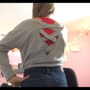 Cute grey long sleeve shirt with Chris cross open back.  Size Small